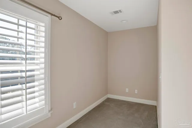 a view of a room with windows