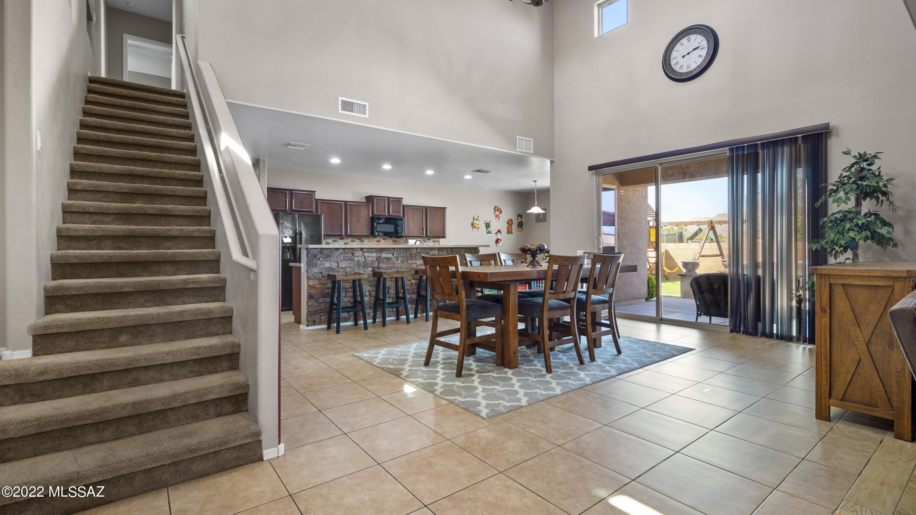 1081 Vista De Los Alamos Rio Rico, AZ 85648 - Photo 13 of 45 a view of a dining room with furniture
