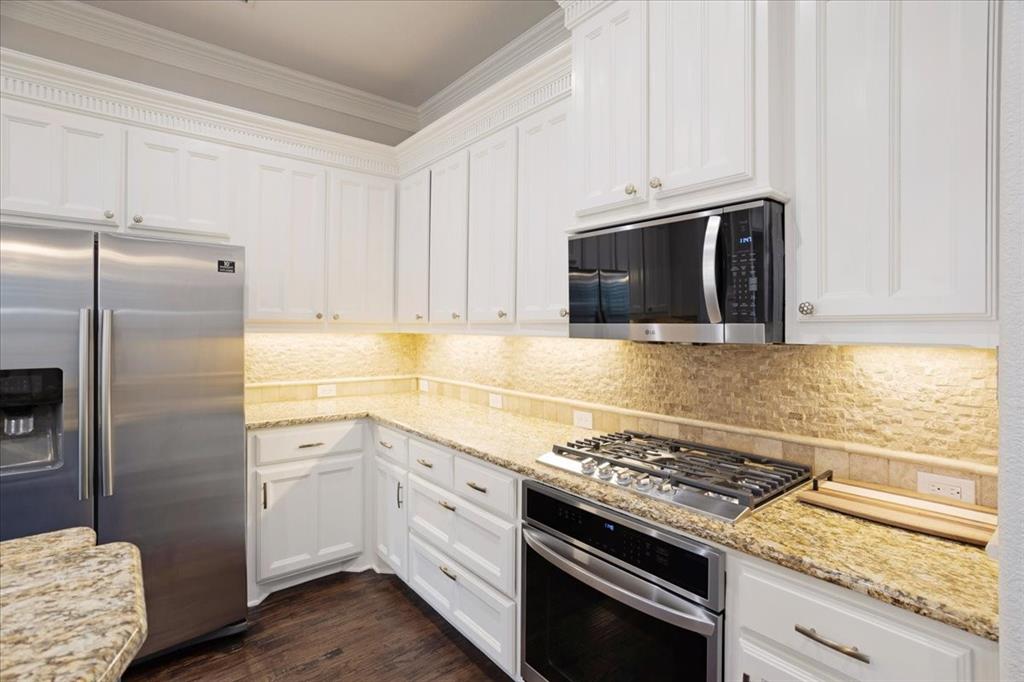 7940 Bishop Road Plano, TX 75024 - Photo 20 of 36 a kitchen with granite countertop cabinets and steel stainless steel appliances
