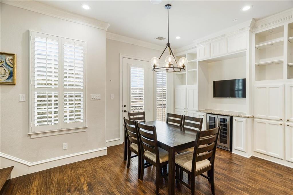 7940 Bishop Road Plano, TX 75024 - Photo 22 of 36 a view of a dining room with furniture window and wooden floor
