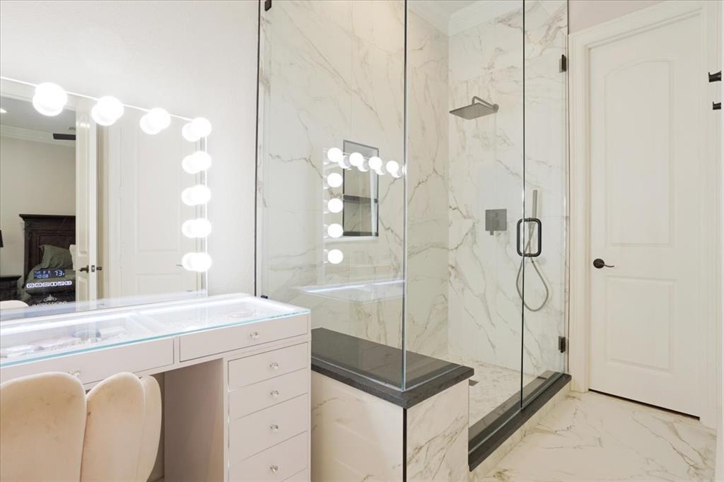 7940 Bishop Road Plano, TX 75024 - Photo 26 of 36 a bathroom with a shower sink and mirror