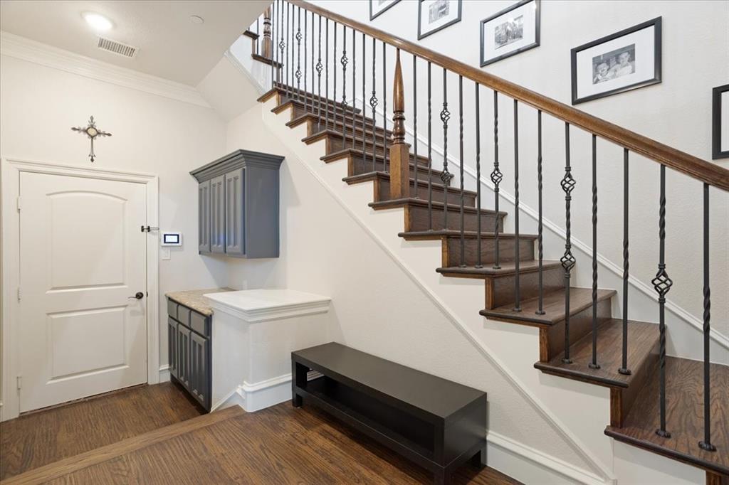 7940 Bishop Road Plano, TX 75024 - Photo 8 of 36 a view of entryway and hall with wooden floor