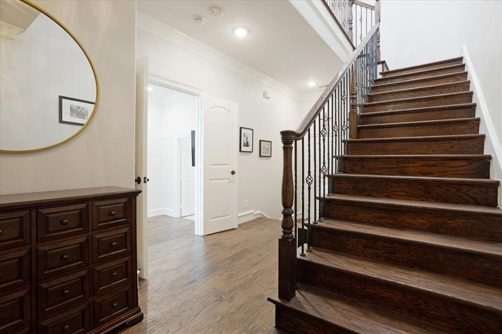 7940 Bishop Road Plano, TX 75024 - Photo 9 of 36 a view of entryway with wooden floor and stairs