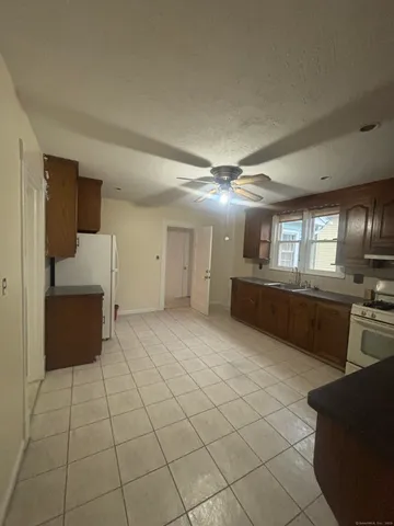 a large room with a large window and furniture