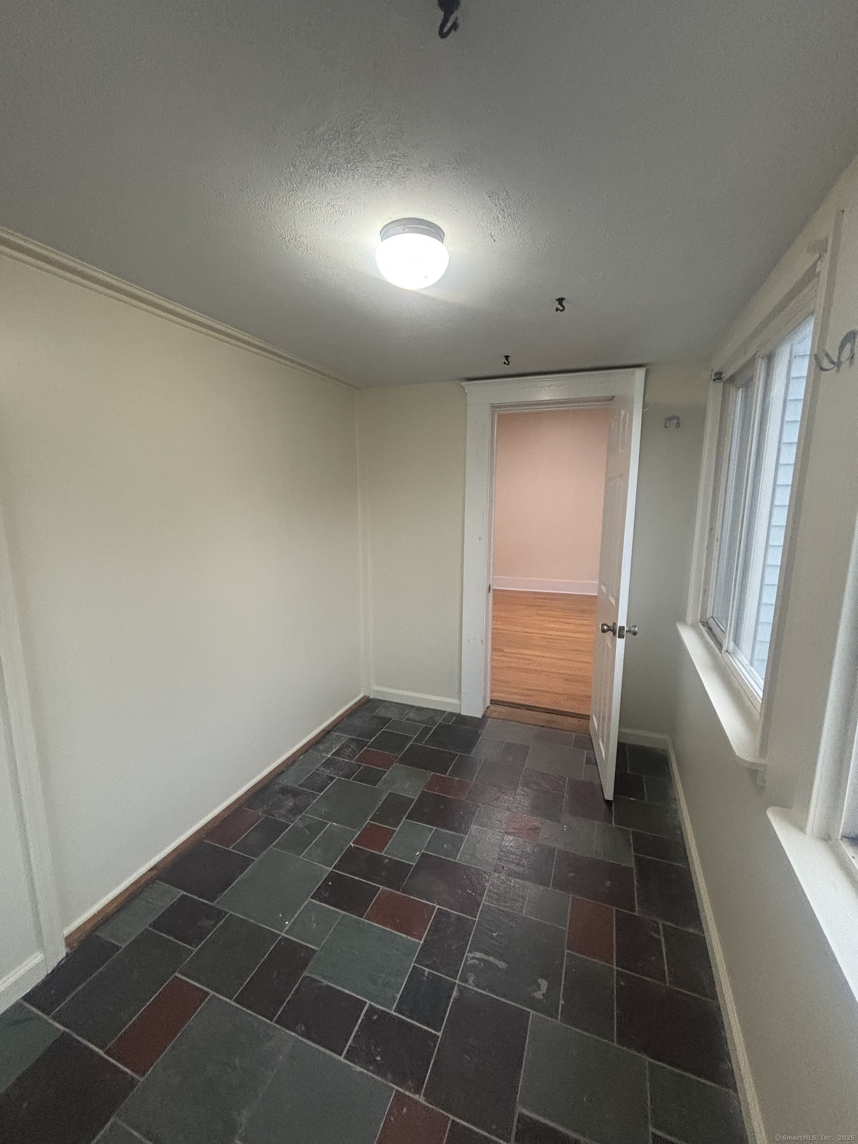 85 South Burritt Street, Unit 3 New Britain, CT 06052 - Photo 7 of 11 a view of an empty room and a window