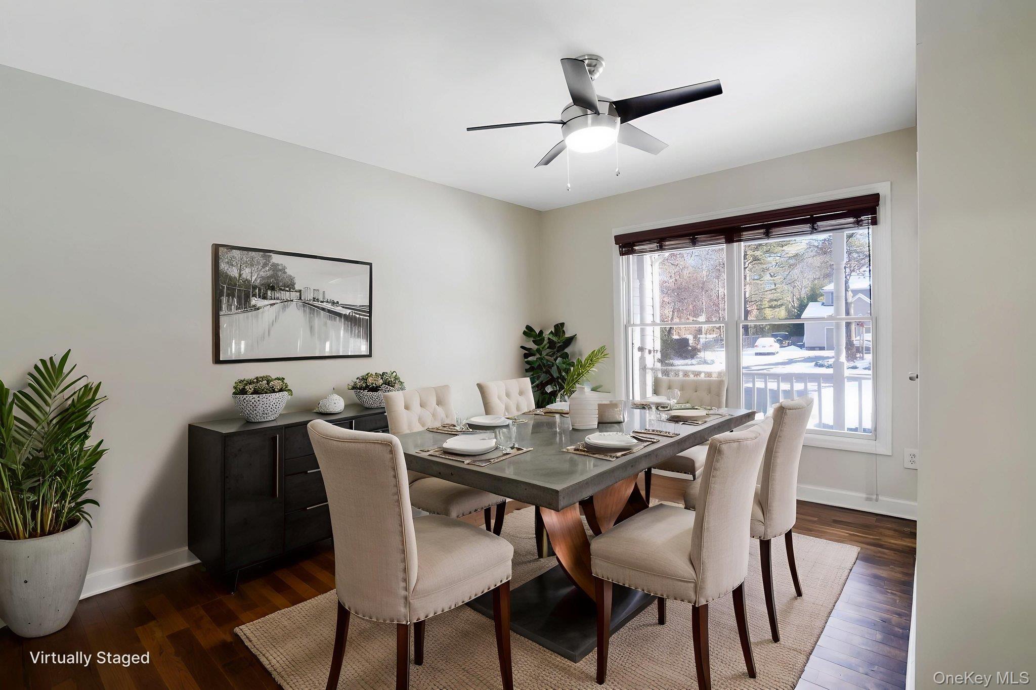 400 Eastport Manor Road Manorville, NY 11949 - Photo 11 of 29 a dining room with furniture window and wooden floor