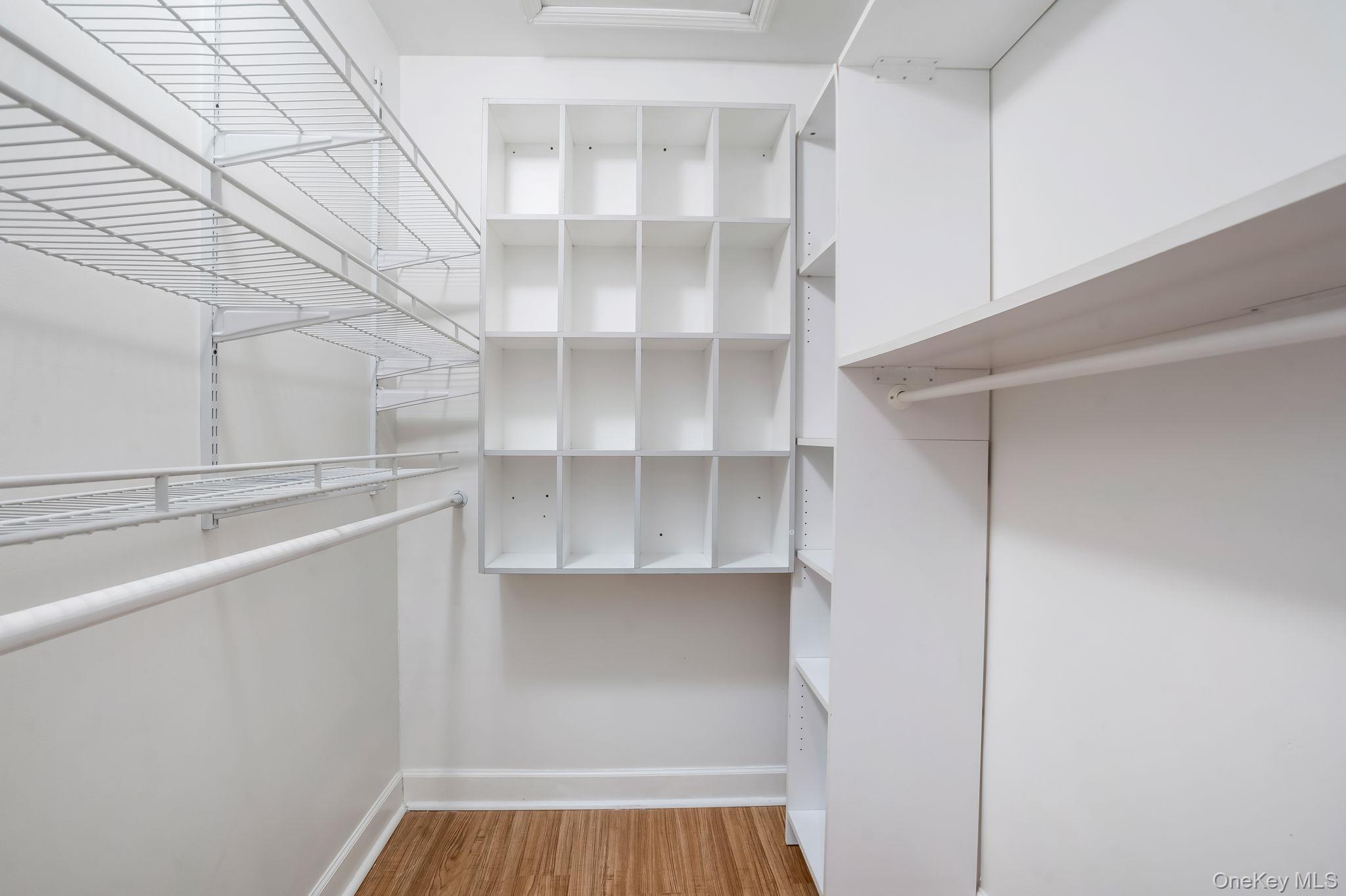 400 Eastport Manor Road Manorville, NY 11949 - Photo 19 of 29 a view of walk in closet with empty racks