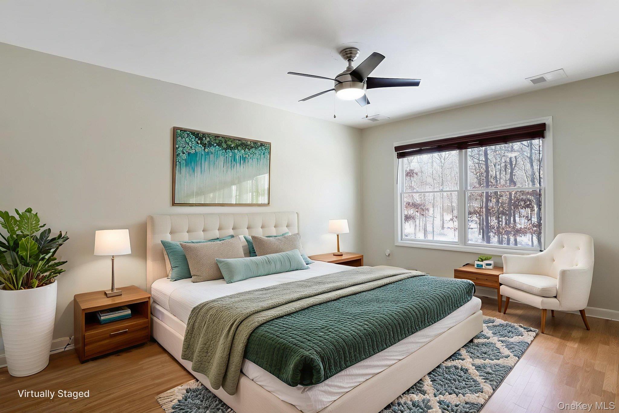 400 Eastport Manor Road Manorville, NY 11949 - Photo 24 of 29 a bedroom with a large bed and a window