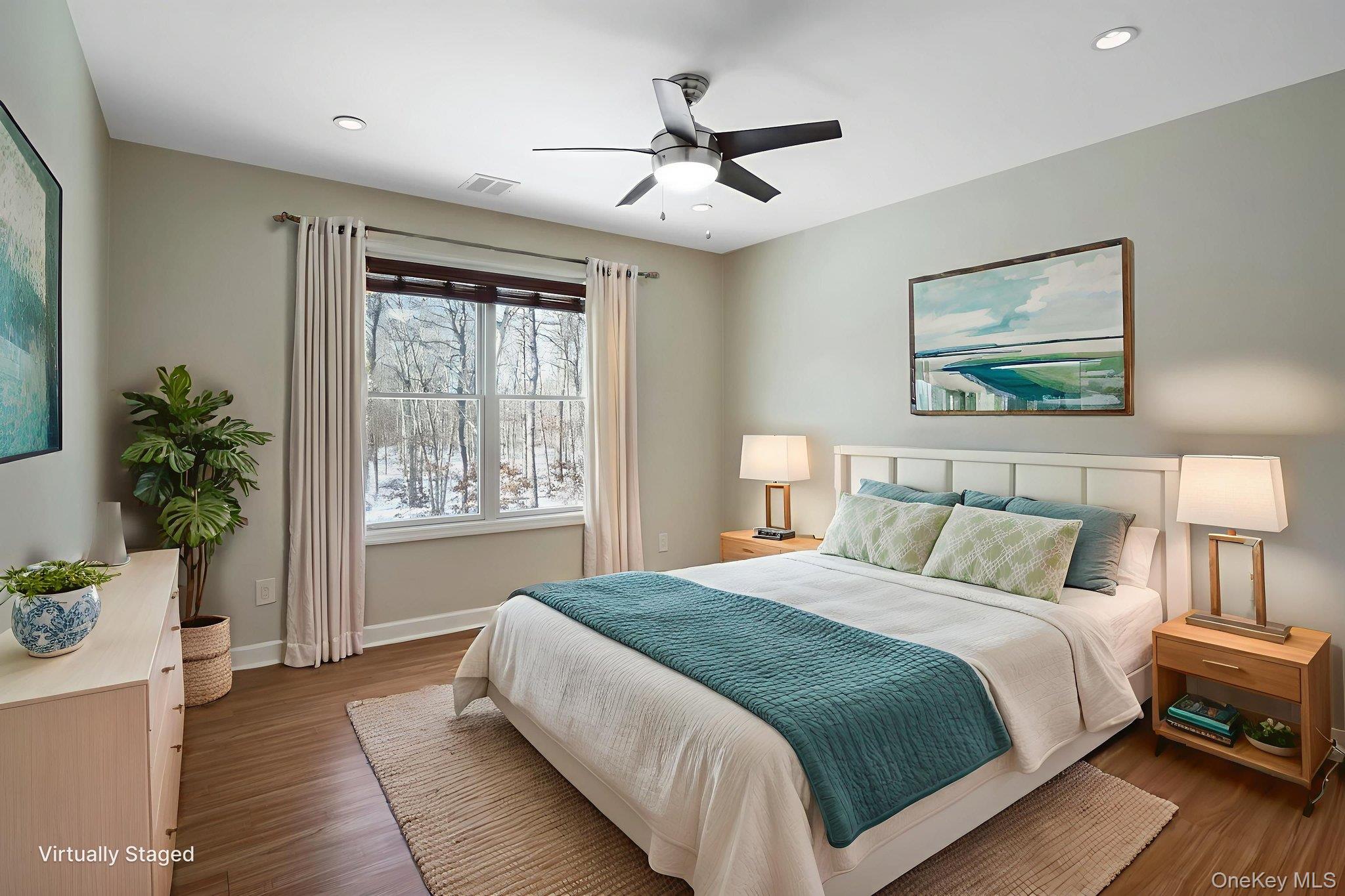 400 Eastport Manor Road Manorville, NY 11949 - Photo 26 of 29 a bedroom with a large bed and a window