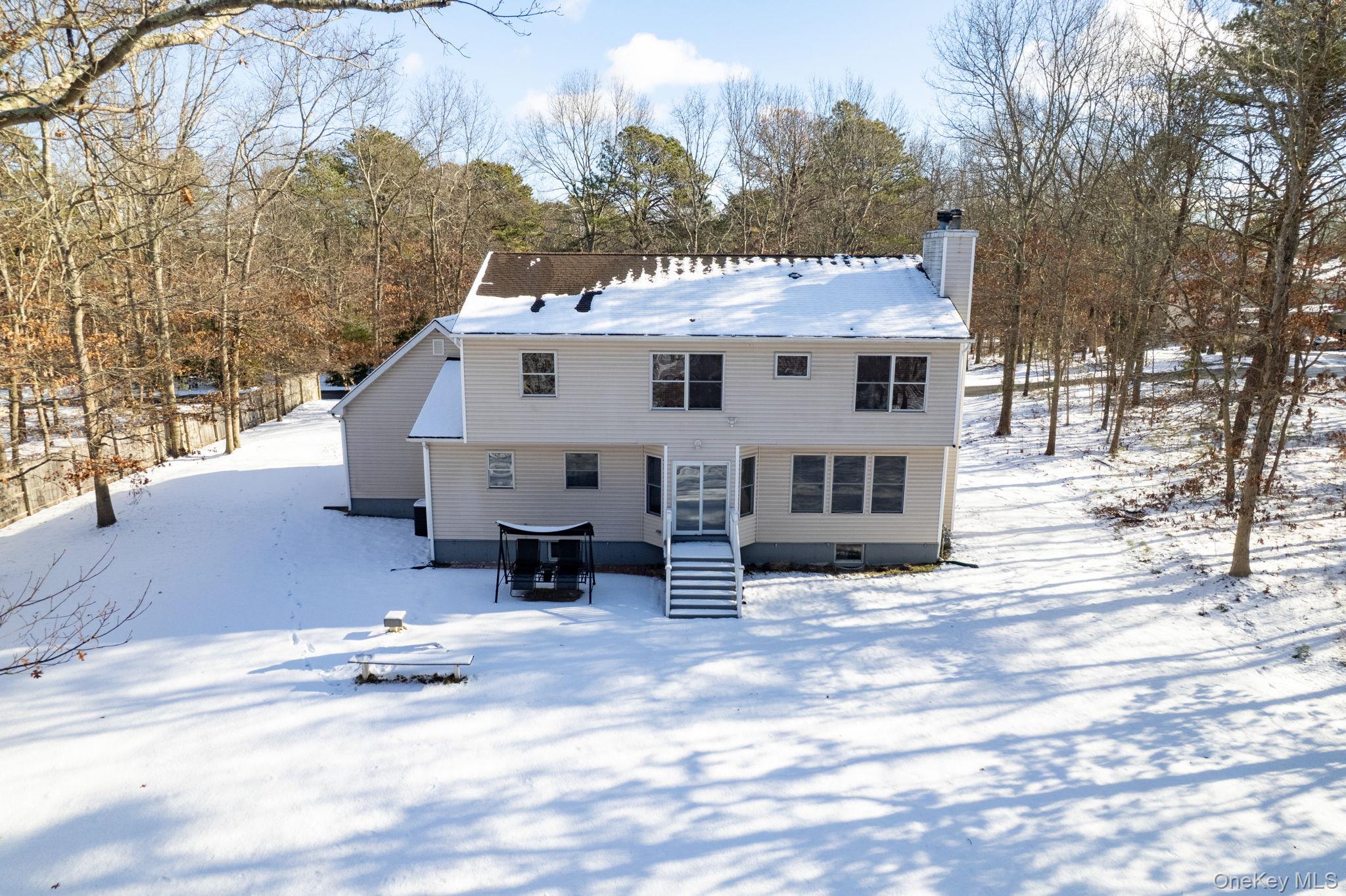 400 Eastport Manor Road Manorville, NY 11949 - Photo 28 of 29 a view of a house with a patio