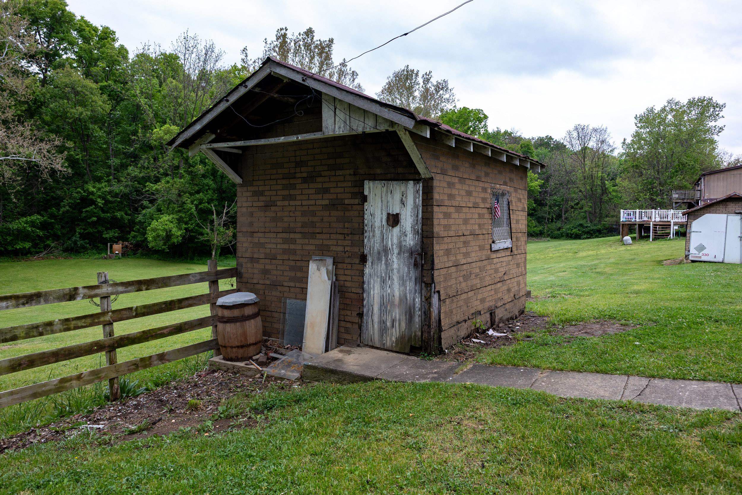 13896 Rockingham Pike Elkton, VA 22827 - Photo 4 of 60 a view of a wooden house with a small yard