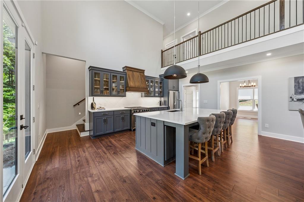 3394 Robinson Road Gainesville, GA 30506 - Photo 12 of 51 a kitchen with stainless steel appliances a kitchen island hardwood floor and a sink
