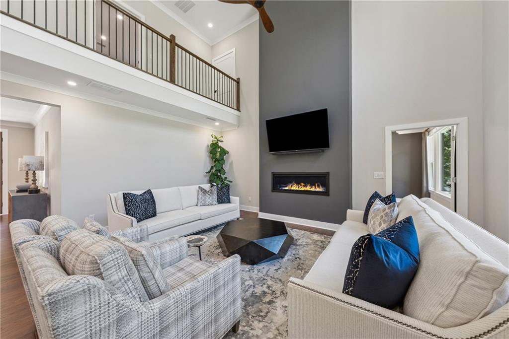 3394 Robinson Road Gainesville, GA 30506 - Photo 16 of 51 a living room with furniture and a flat screen tv