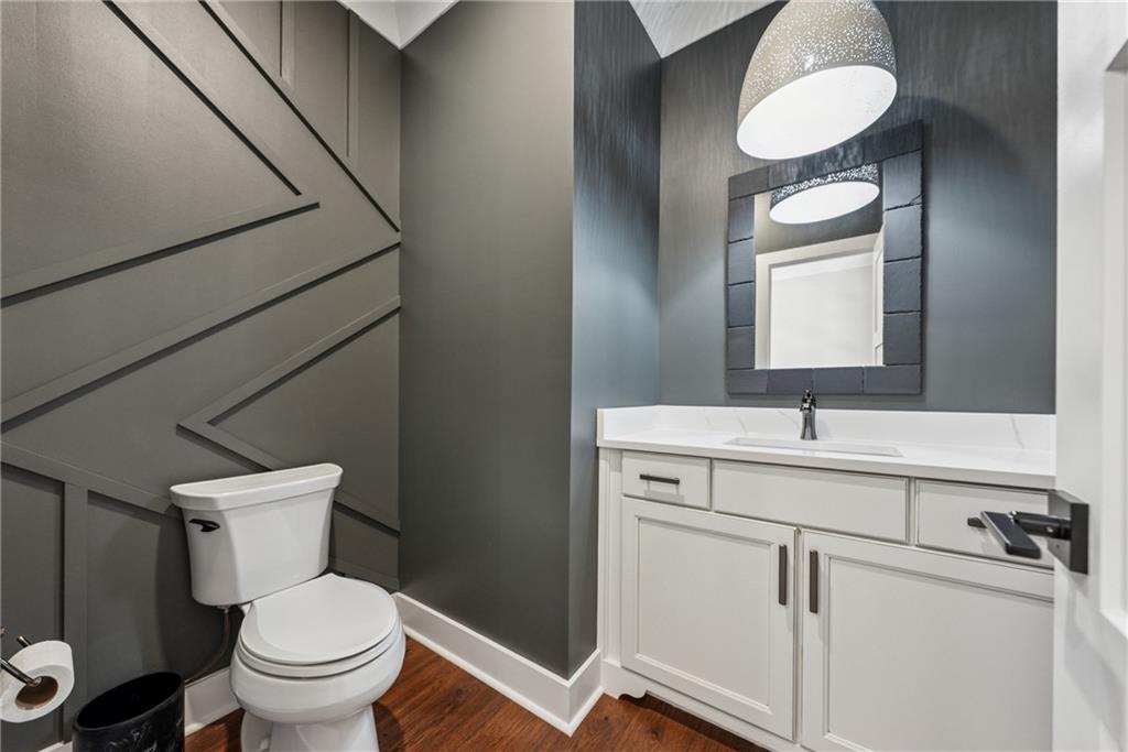 3394 Robinson Road Gainesville, GA 30506 - Photo 21 of 51 a bathroom with a toilet sink and mirror