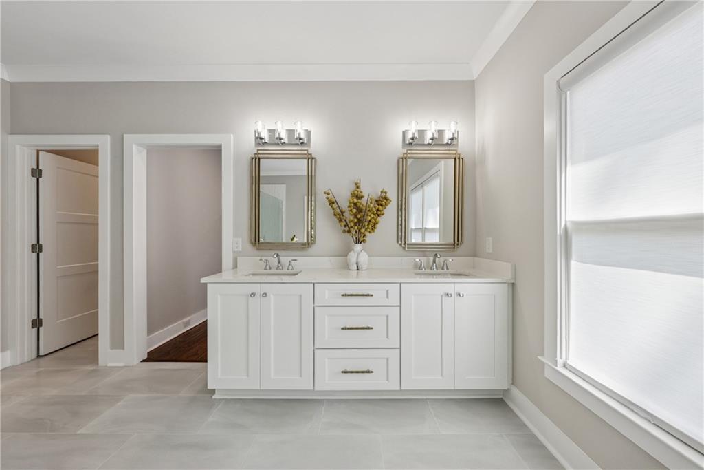 3394 Robinson Road Gainesville, GA 30506 - Photo 28 of 51 a spacious bathroom with a double vanity sink and a mirror