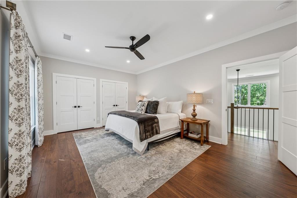 3394 Robinson Road Gainesville, GA 30506 - Photo 34 of 51 a bedroom with a bed and wooden floor