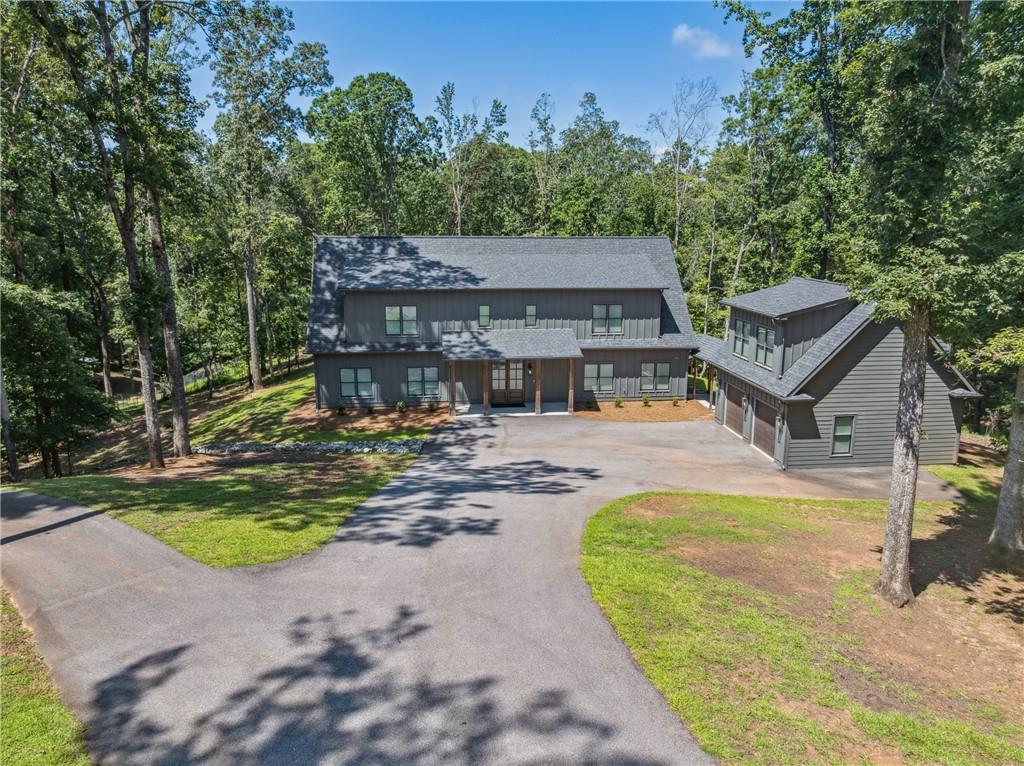 3394 Robinson Road Gainesville, GA 30506 - Photo 49 of 51 a view of a house with swimming pool next to a yard