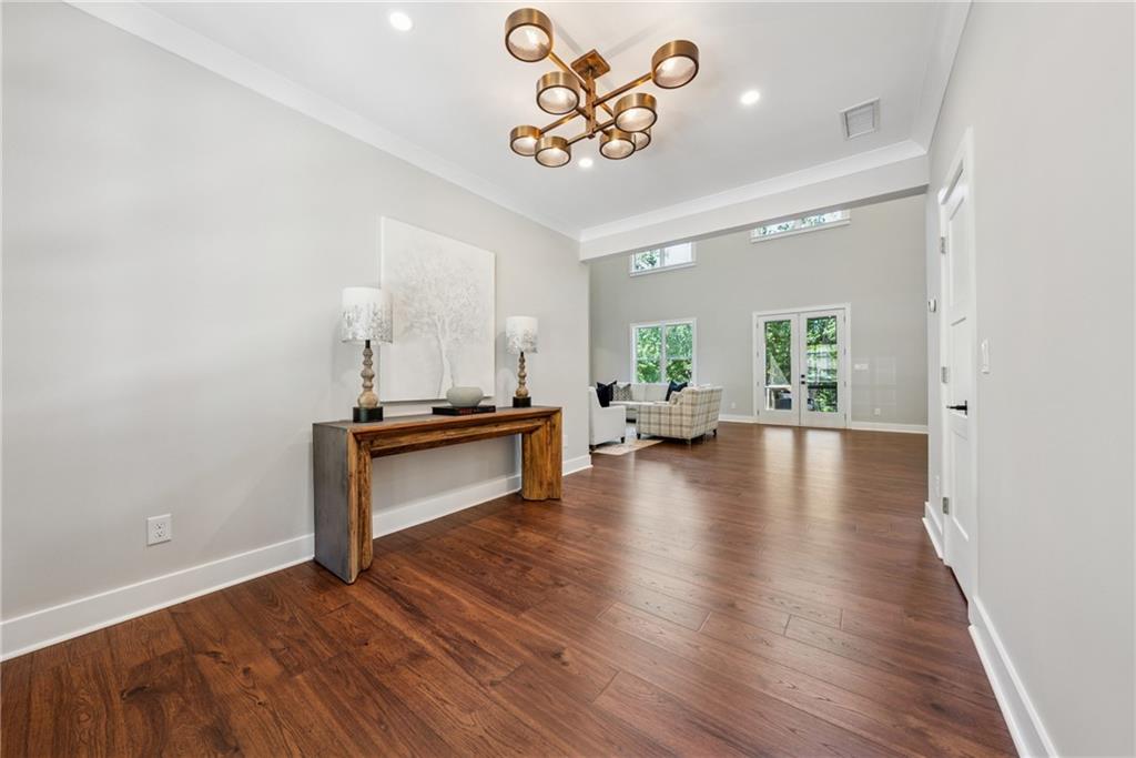 3394 Robinson Road Gainesville, GA 30506 - Photo 6 of 51 a view of an empty room and kitchen with wooden floor
