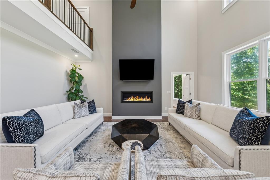 3394 Robinson Road Gainesville, GA 30506 - Photo 7 of 51 a living room with furniture and a fireplace