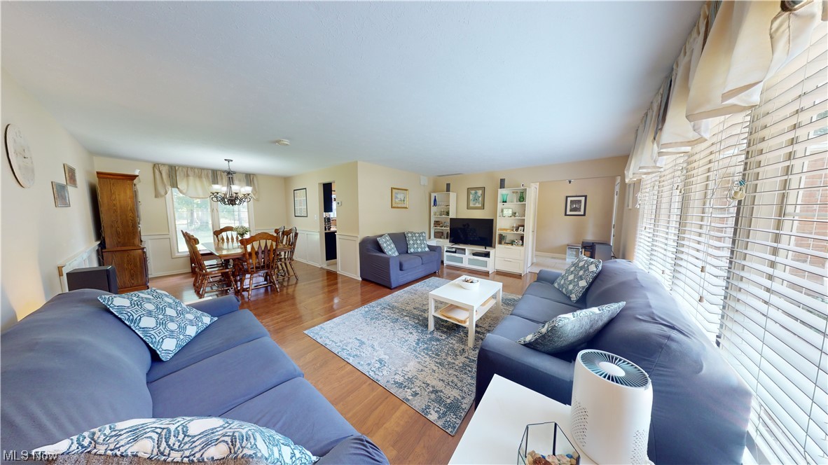 1071 Roland Road Lyndhurst, OH 44124 - Photo 3 of 30 Hardwood floored living room featuring a chandelier