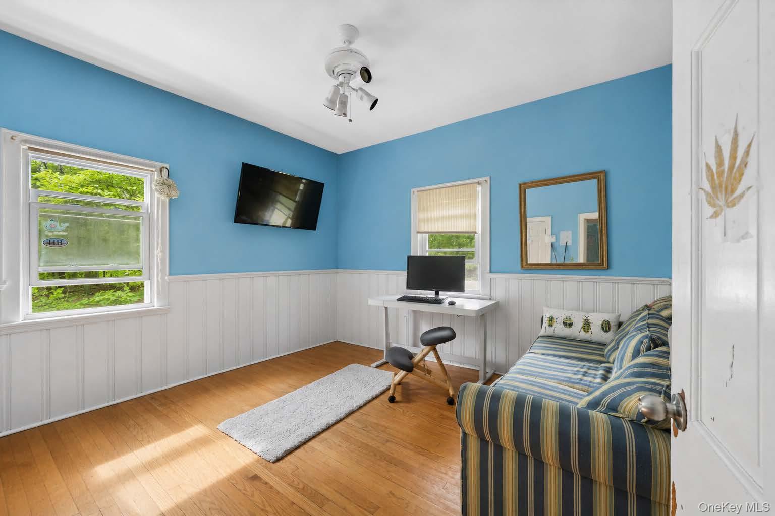 131 Red Creek Road Hampton Bays, NY 11946 - Photo 16 of 35 a livingroom with workspace and a window