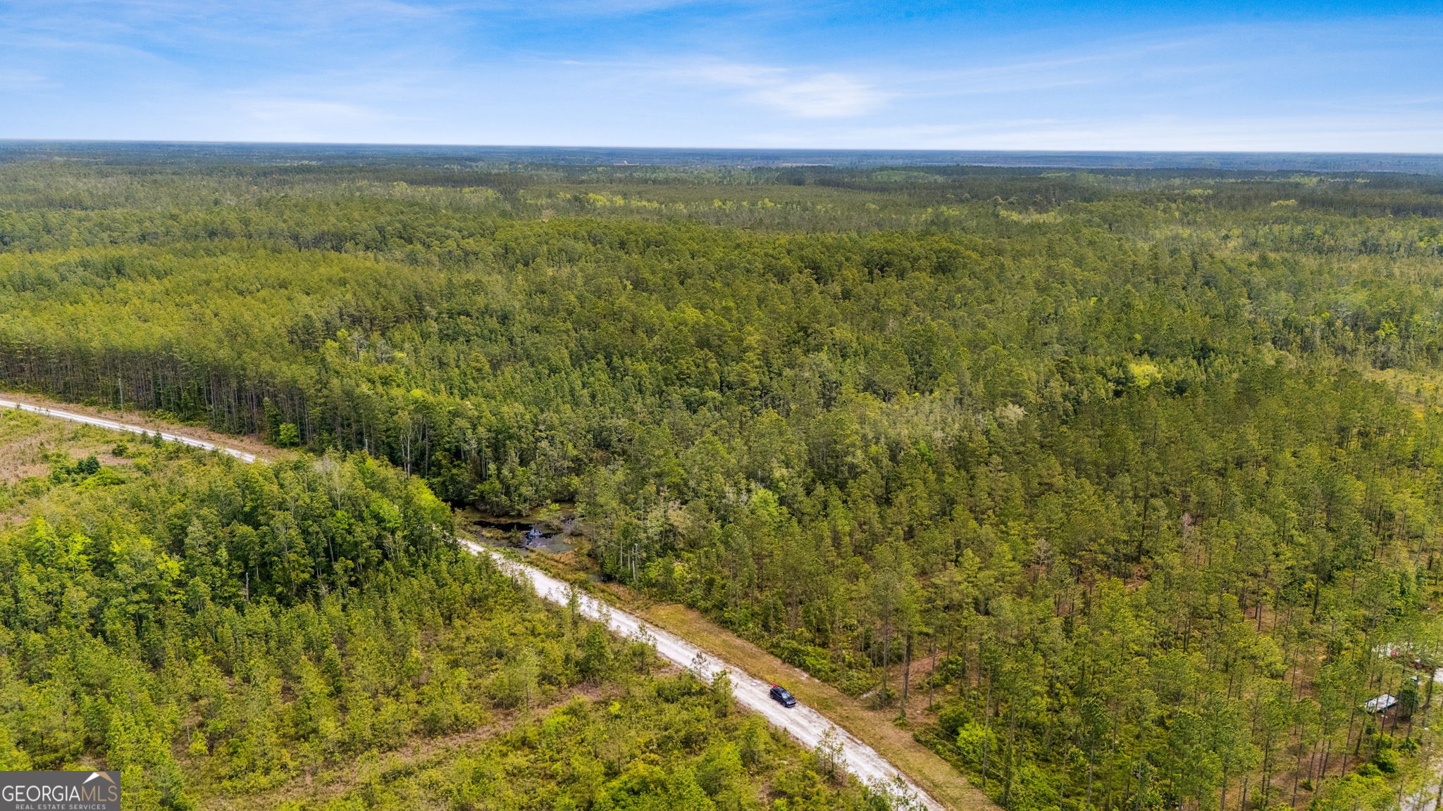 V/l 102 Old Reserve Road Waverly, GA 31565 - Photo 4 of 17 a view of a field with an ocean