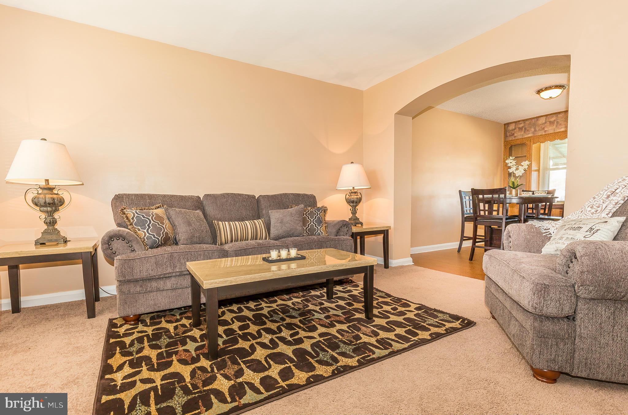 3417 Dunran Road Dundalk, MD 21222 - Photo 1 of 29 a living room with furniture and a couch