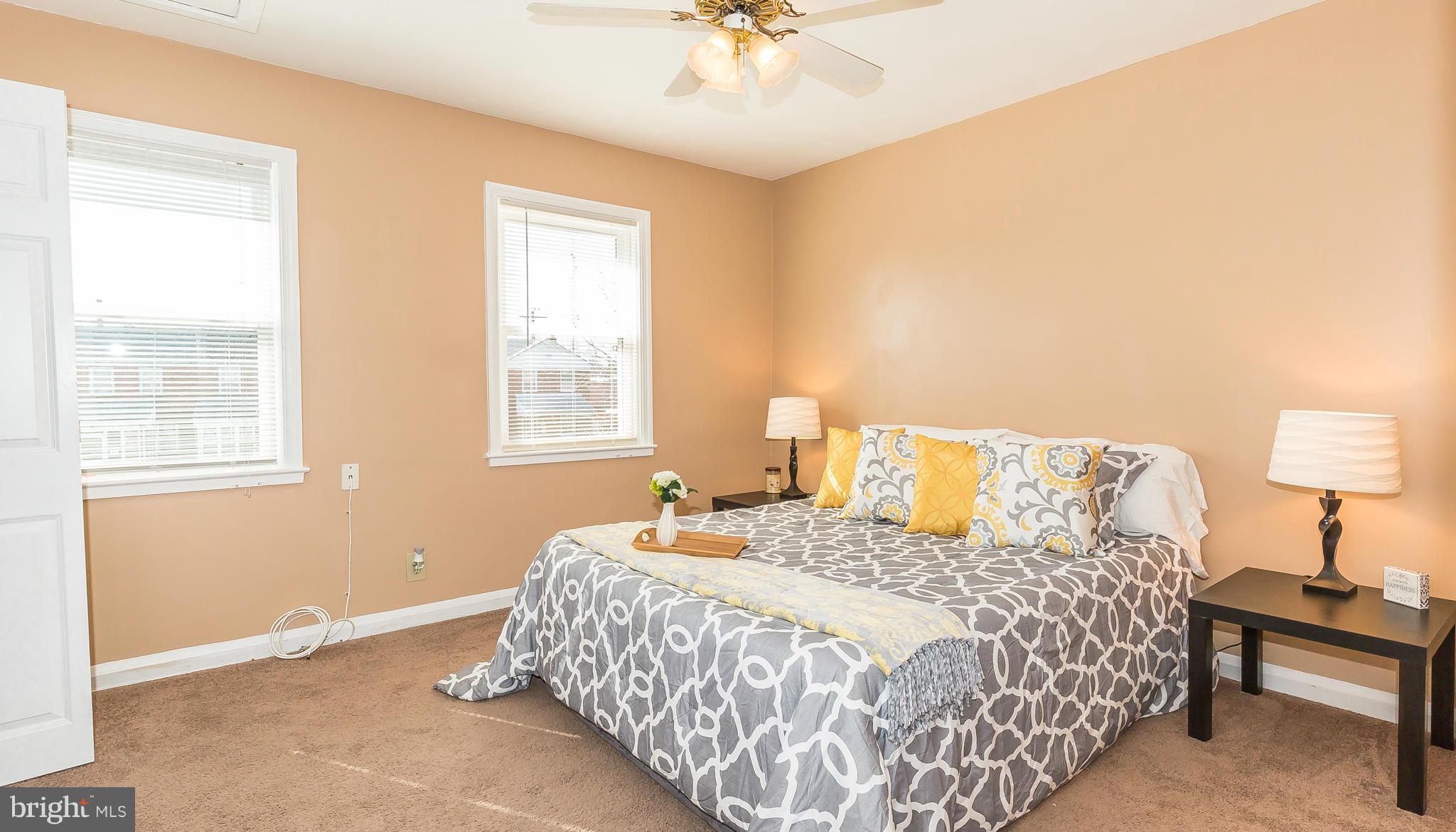 3417 Dunran Road Dundalk, MD 21222 - Photo 11 of 29 a bedroom with a bed and a chandelier