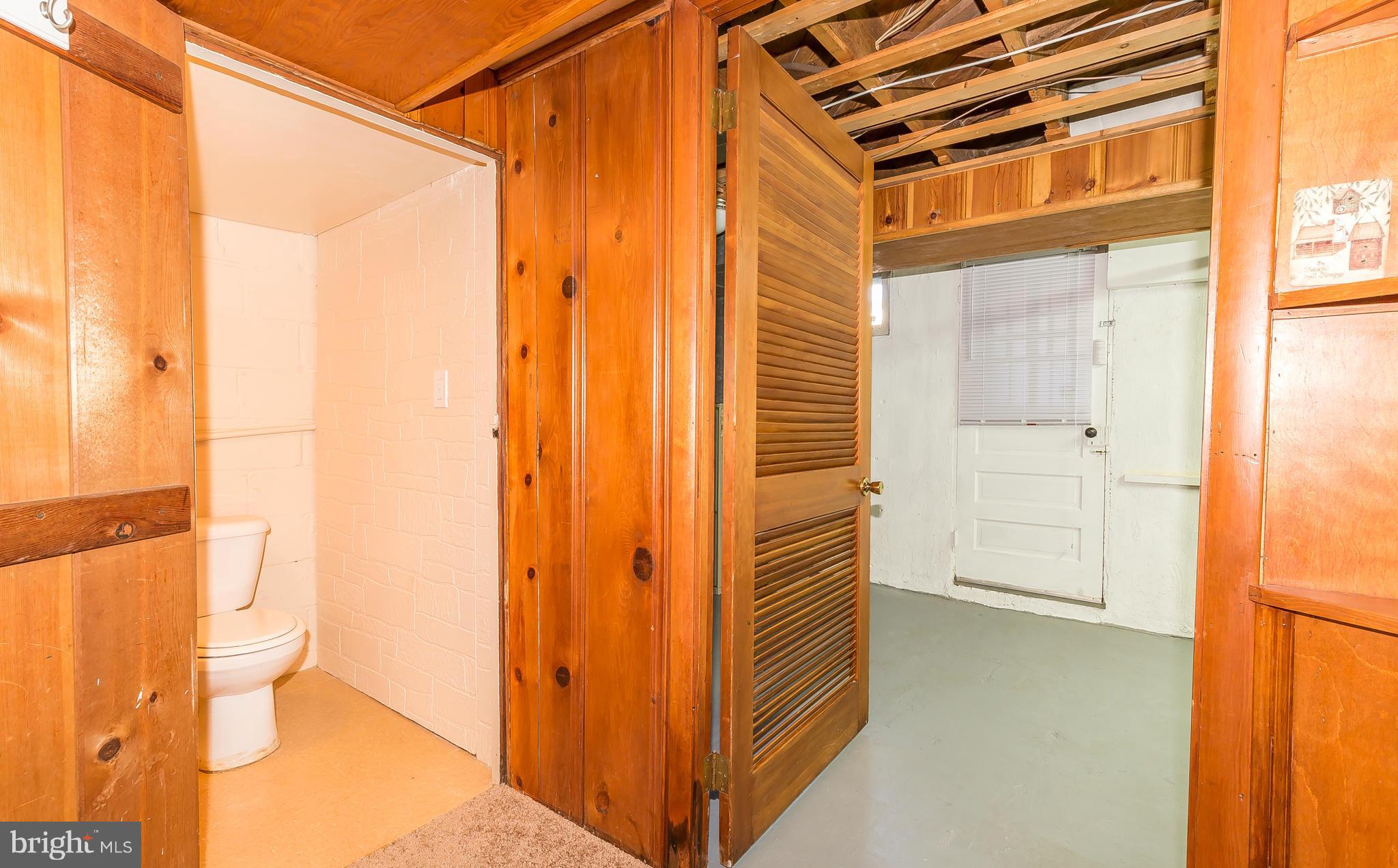 3417 Dunran Road Dundalk, MD 21222 - Photo 23 of 29 a view of a bathroom with a shower and a door