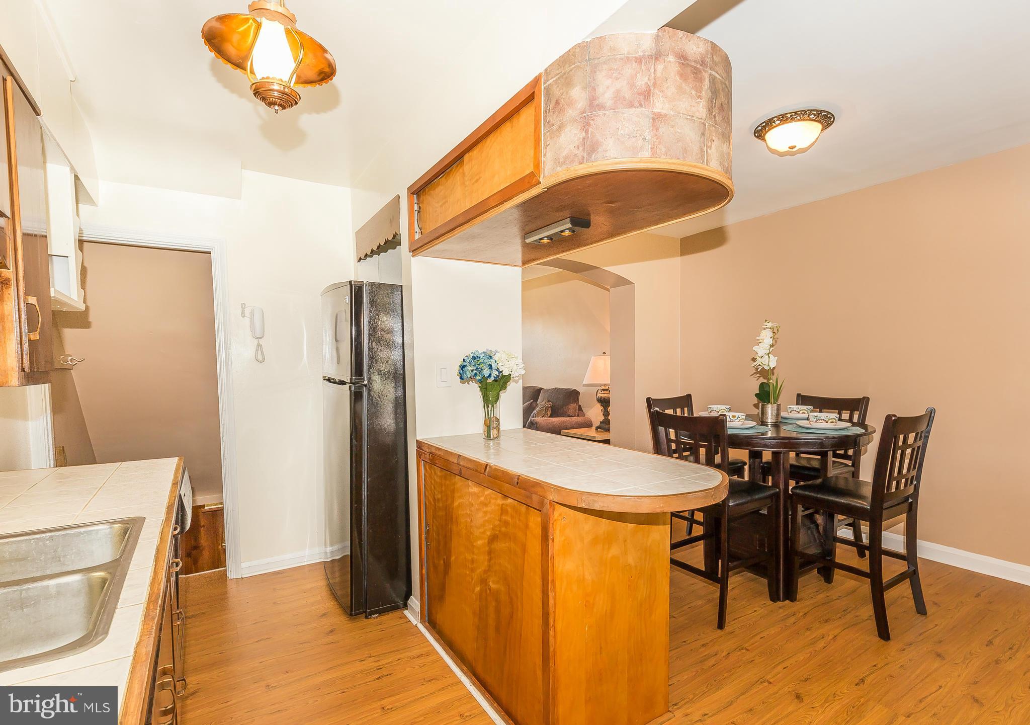 3417 Dunran Road Dundalk, MD 21222 - Photo 8 of 29 a dining room with a table and chairs