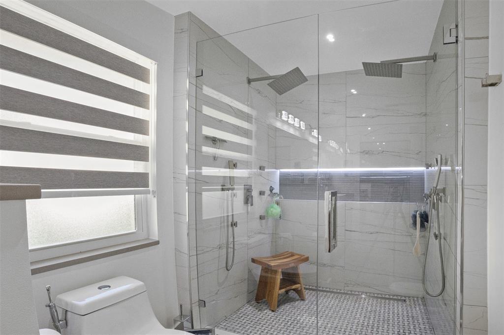 8125 Royal Palm Court, Unit 2 Tamarac, FL 33321 - Photo 16 of 35 a bathroom with a shower and toilet