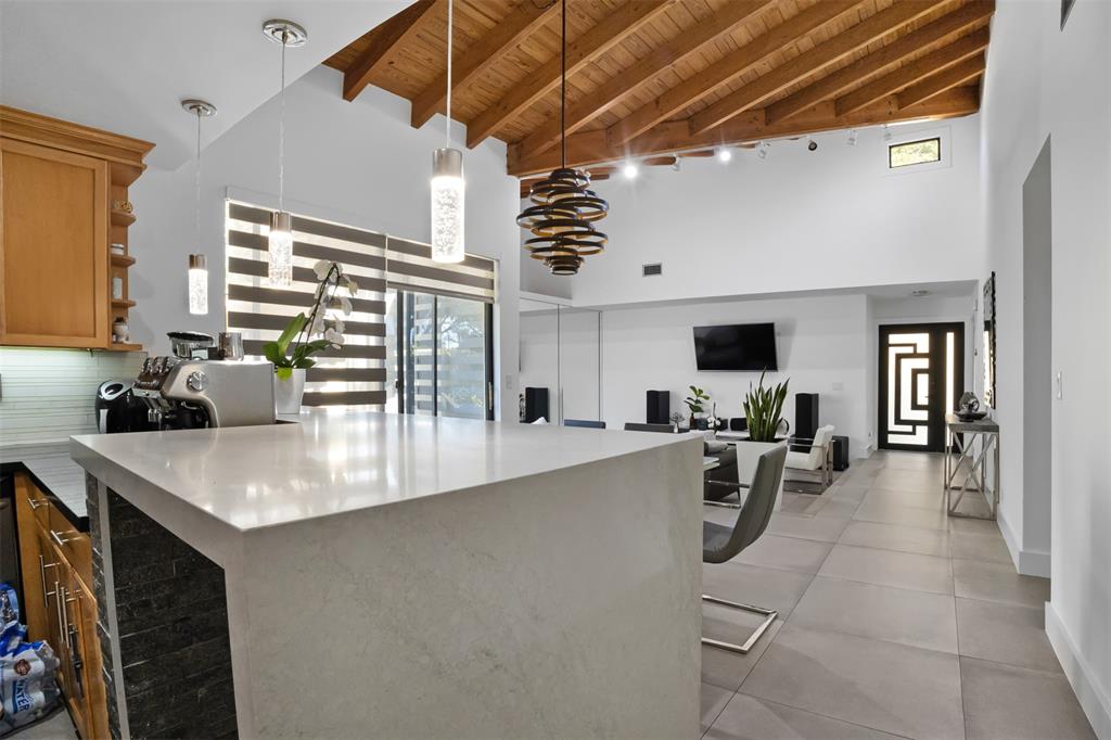 8125 Royal Palm Court, Unit 2 Tamarac, FL 33321 - Photo 8 of 35 a kitchen with a sink a counter top space and living room view