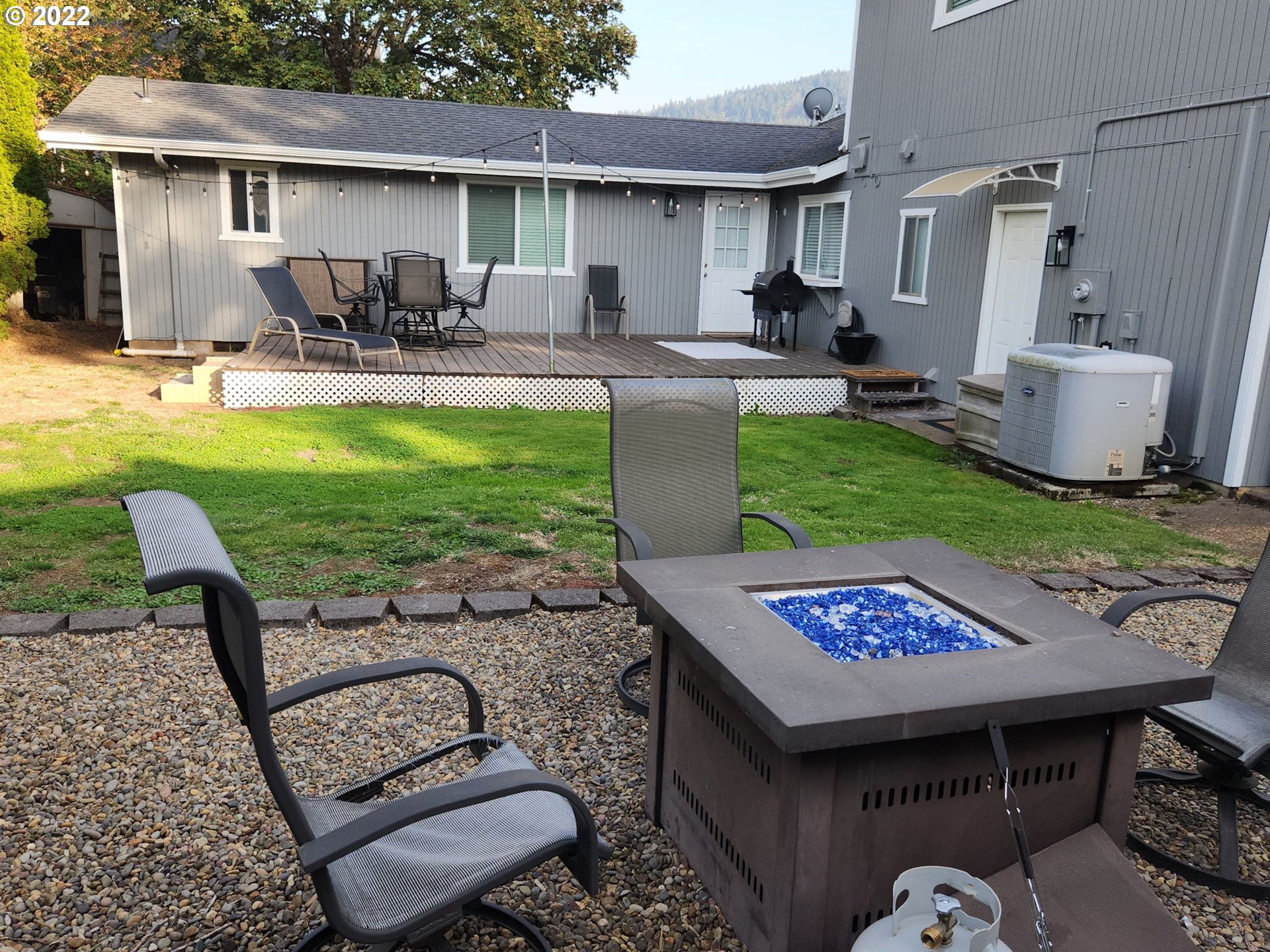 480 72nd Street Springfield, OR 97478 - Photo 5 of 24 a view of a backyard with sitting area and furniture