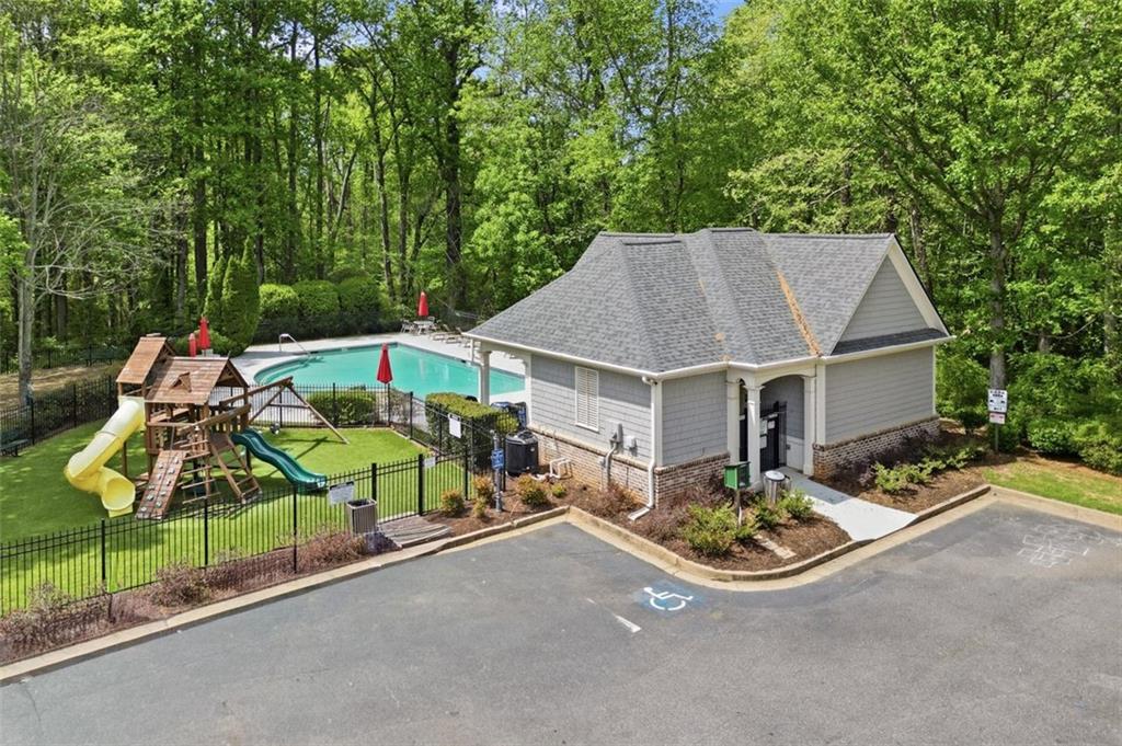 1114 Firethorne Pass Cumming, GA 30040 - Photo 36 of 43 an aerial view of a house with swimming pool and trees
