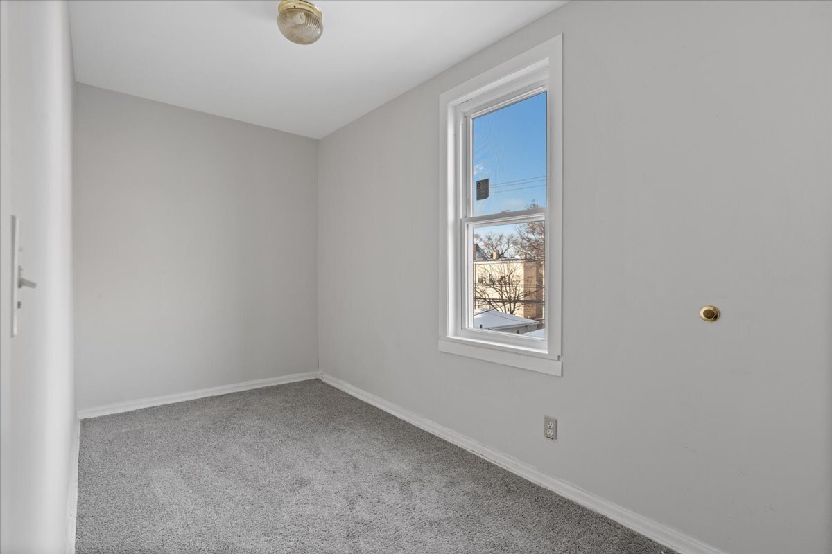 2338 North Avers Avenue, Unit 2 Chicago, IL 60647 - Photo 19 of 23 an empty room with windows