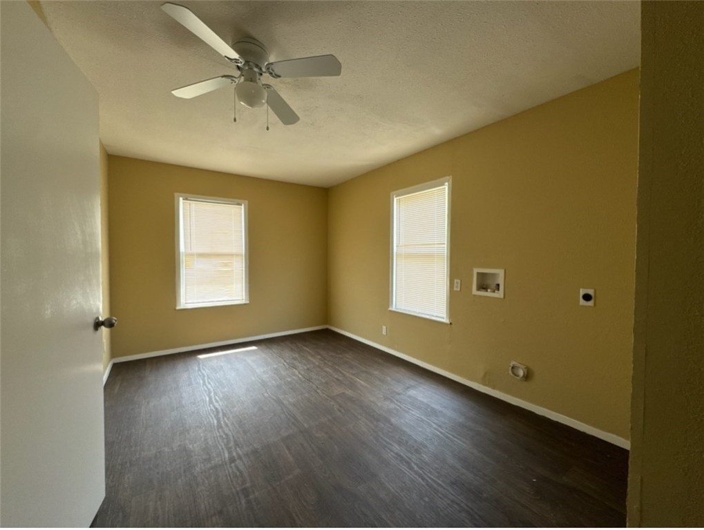 4905 Weber Road Corpus Christi, TX 78411 - Photo 5 of 5 an empty room with a window and wooden floor