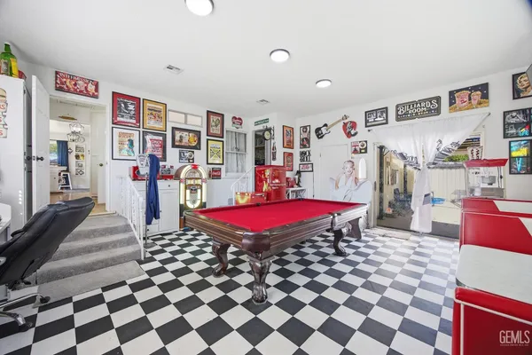 a view of a dining room with furniture and a window