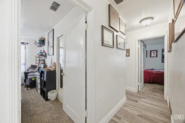 a spacious bathroom with a double vanity sink and a mirror
