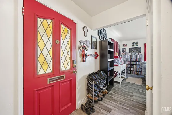 a view of a room with lots of stuff and hardwood floor