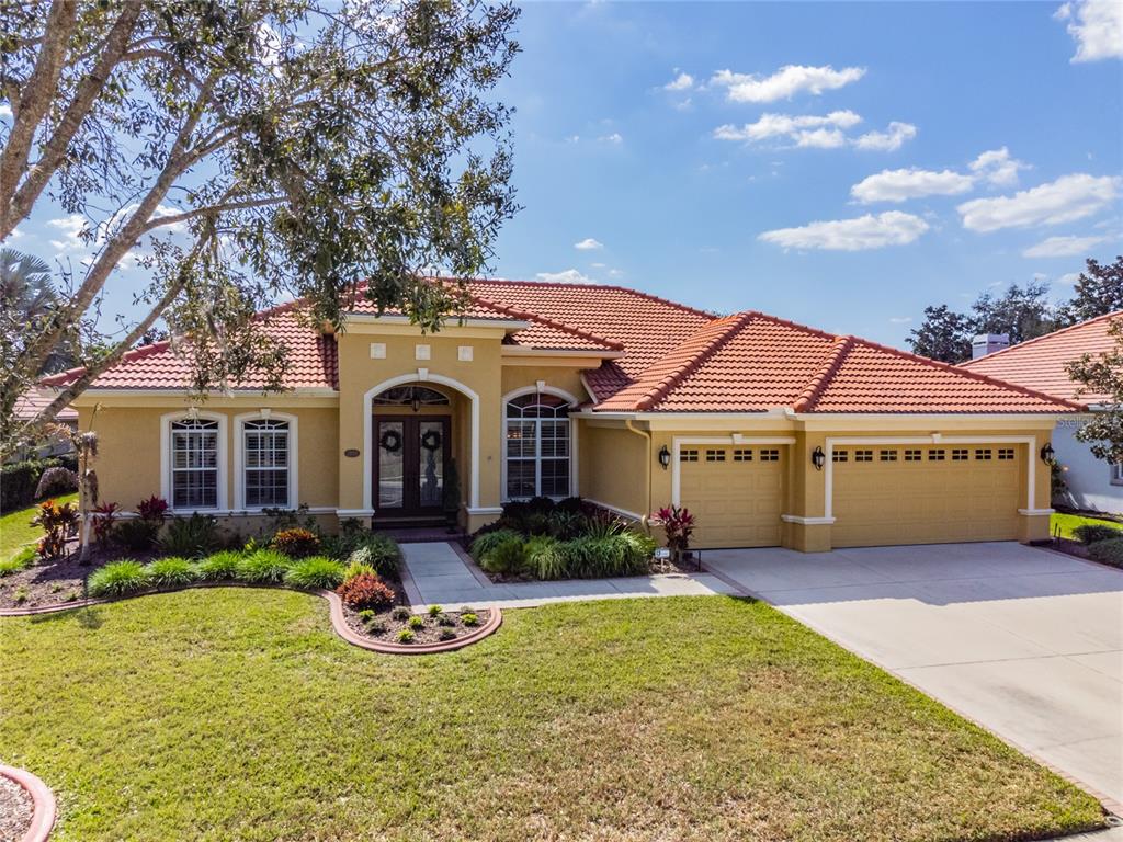 a front view of a house with garden and porch