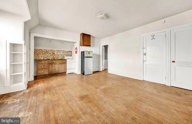 a view of a storage & utility room with a sink