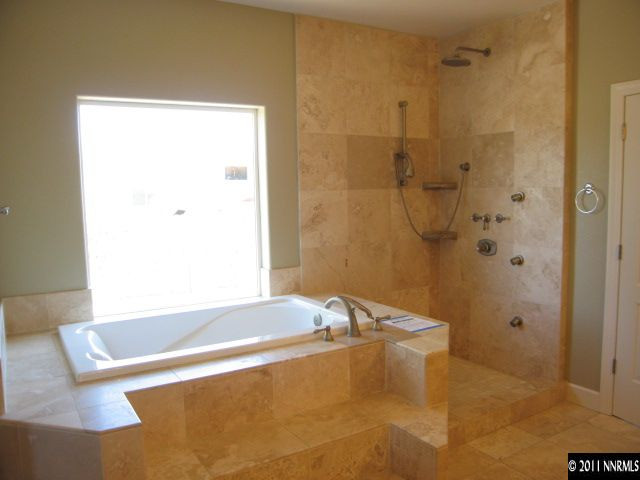 4805 Rancheria Road Fallon, NV 89406 - Photo 11 of 13 a bathroom with a bathtub and shower