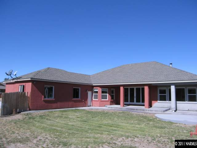 4805 Rancheria Road Fallon, NV 89406 - Photo 3 of 13 a front view of a house with a garden