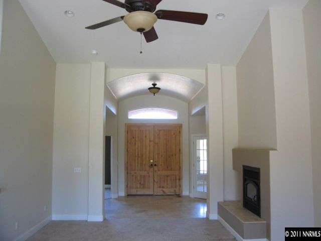 4805 Rancheria Road Fallon, NV 89406 - Photo 5 of 13 a view of a livingroom with a fireplace and window