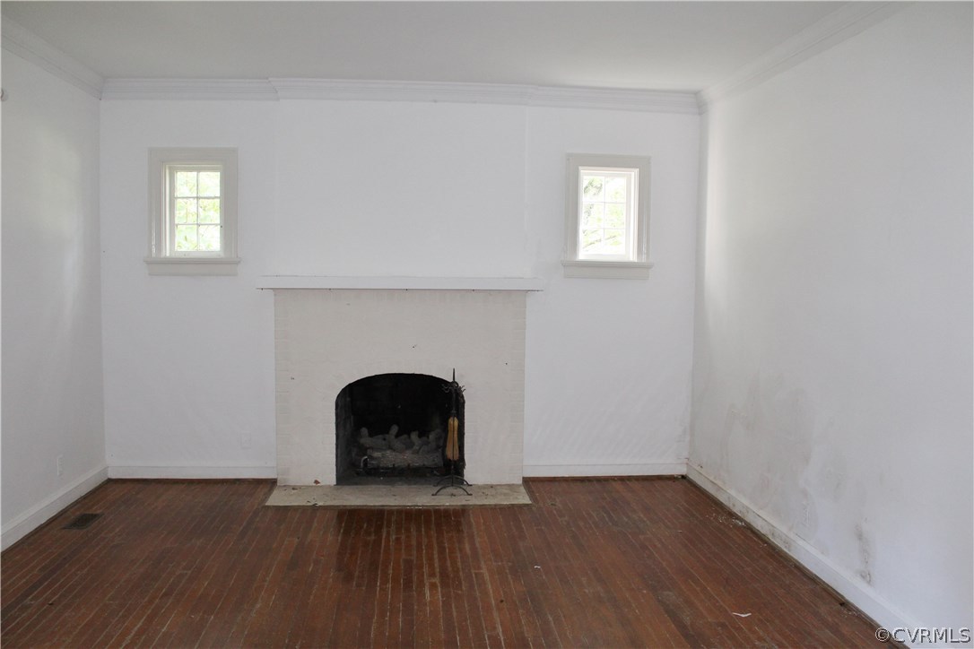 2610 Corner Rock Road Midlothian, VA 23113 - Photo 13 of 15 a view of an empty room with wooden floor and a window
