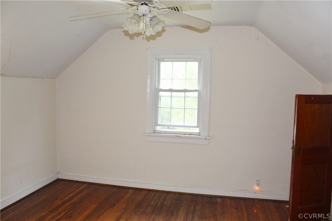 2610 Corner Rock Road Midlothian, VA 23113 - Photo 15 of 15 an empty room with wooden floor chandelier fan and window