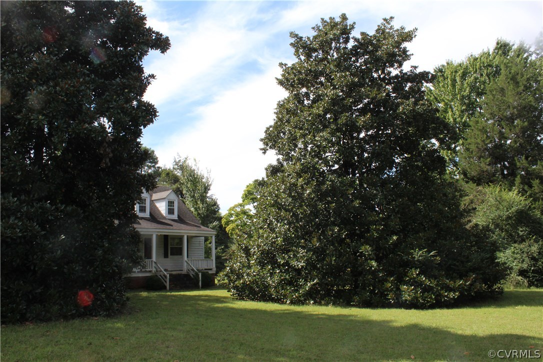 2610 Corner Rock Road Midlothian, VA 23113 - Photo 5 of 15 a front view of a house with a garden