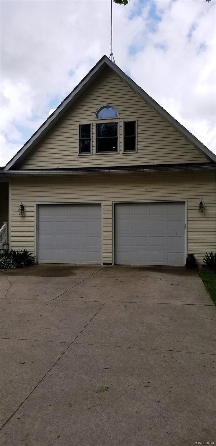 5800 Milett Road Fowlerville, MI 48836 - Photo 7 of 52 Two-Car attached Garage with Bonus Room above