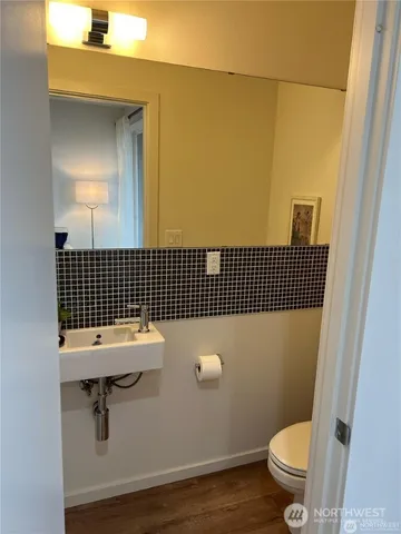 a bathroom with a sink toilet and vanity
