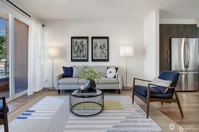 a living room with furniture rug and window